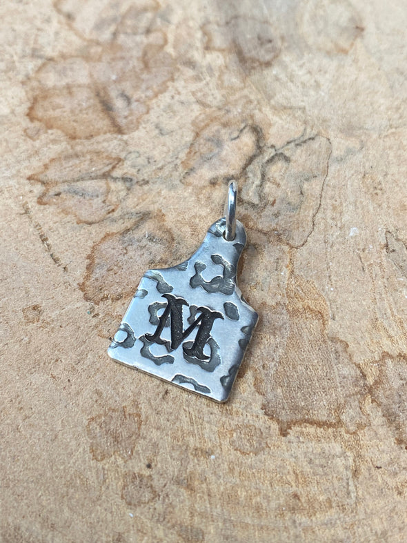 Letter M cow tag charm